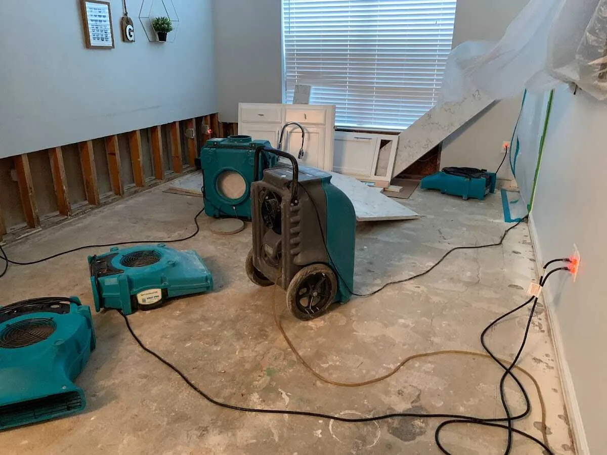 Dehumidifier in flood-cut room for Water Damage Restoration in Longmont